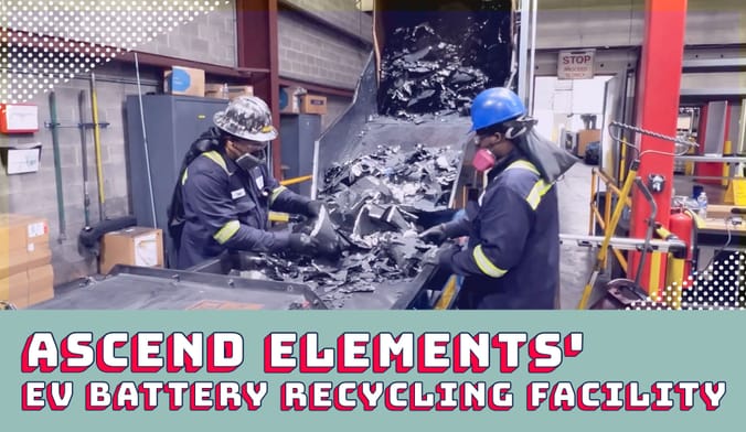 Workers in safety gear sort through scrap material on a conveyer built