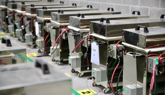 Battery-testing equipment lined up inside a facility