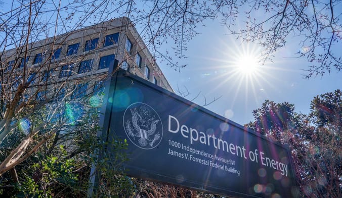 A sign in front of an office building reads "Department of Energy"