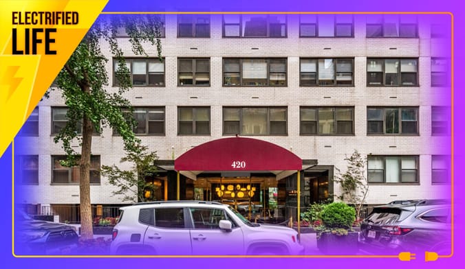 An apartment building facade with a red canopy over the door. A purple and yellow border includes the text "Electrified Life"