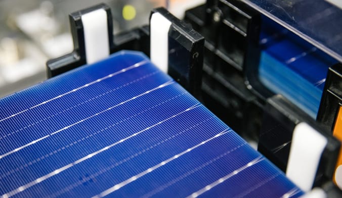 Close-up shot of a blue rectangle on black robotic equipment