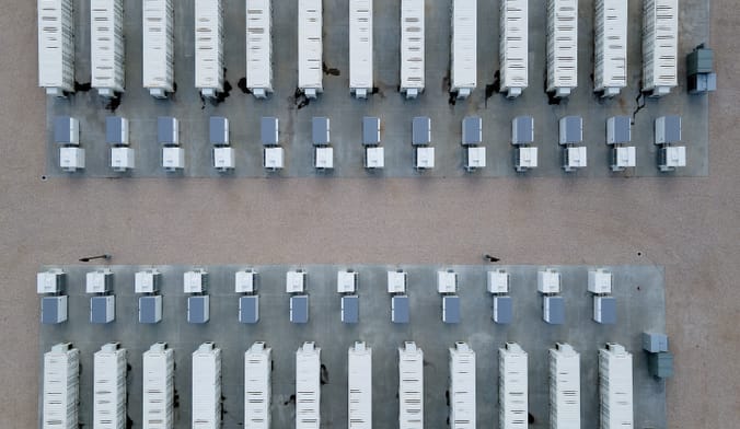 Overhead shot of rows of batteries outside.