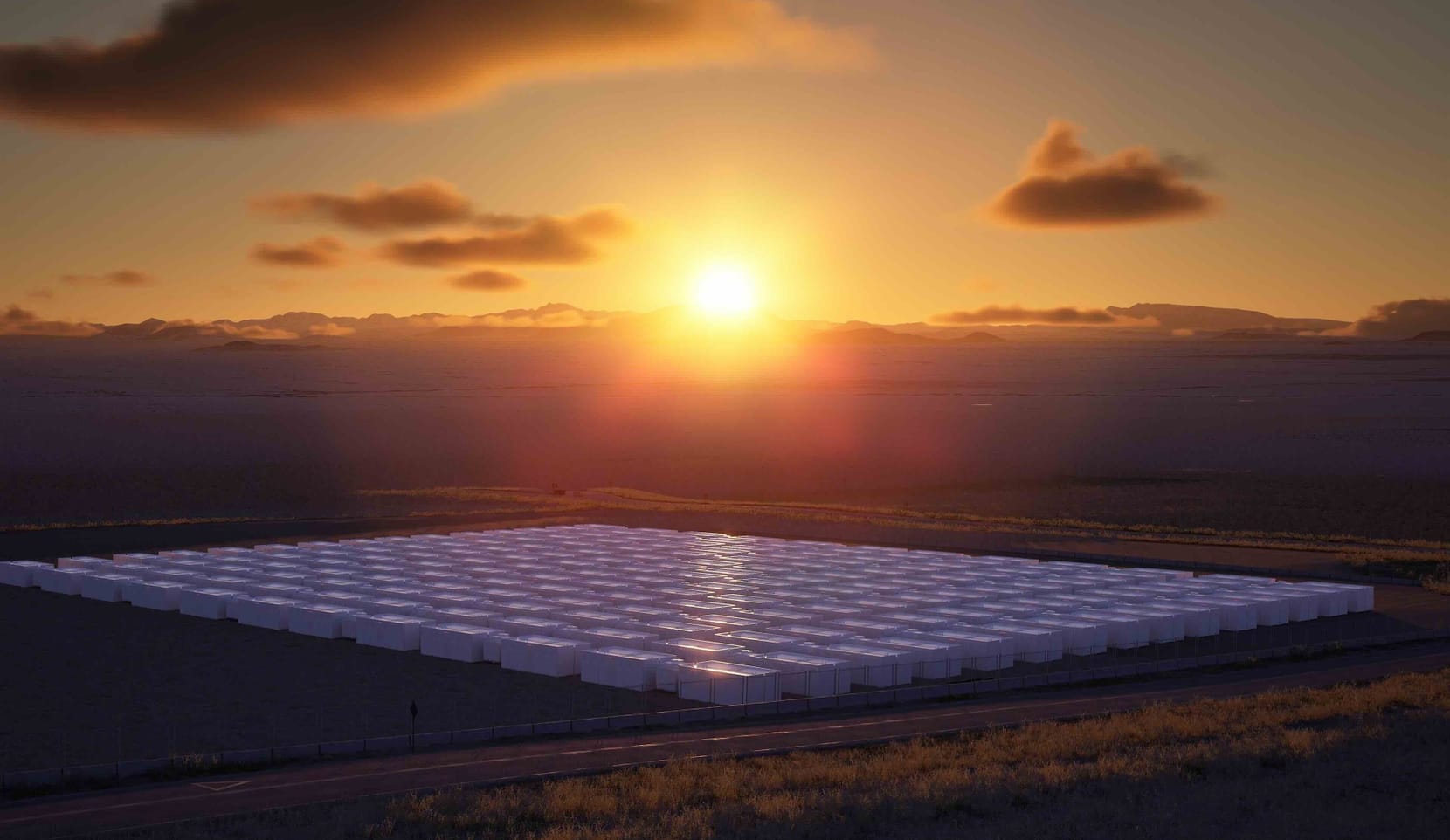 a square of big white boxes against the backdrop of a sunset