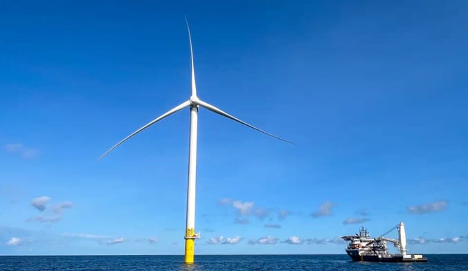 A wind turbine stands in the water off the coast of Rhode Island and Connecticut.